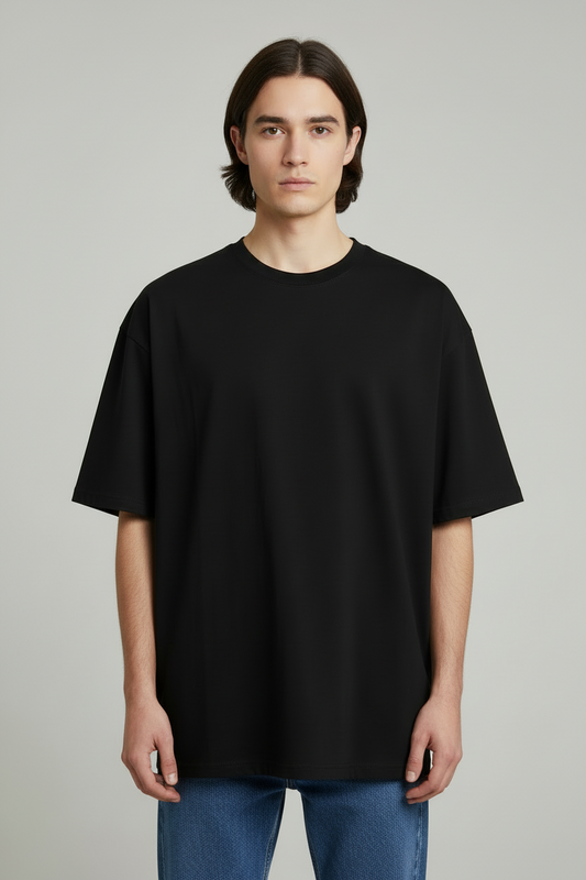 1Person wearing a black t-shirt and blue jeans on a gray background